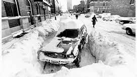 A car is stranded in the snow by the Chicago Blizzard of 1967.