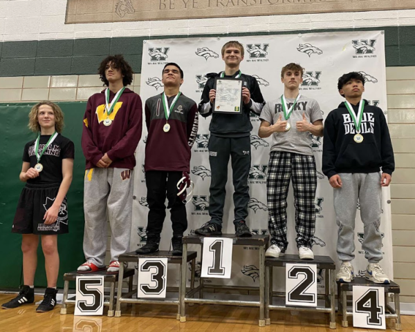 Six male wrestlers ordered on a podium. Shawn Hanton placed 2nd at the Walther Christian Hoger Tournament on December 9th 2023.