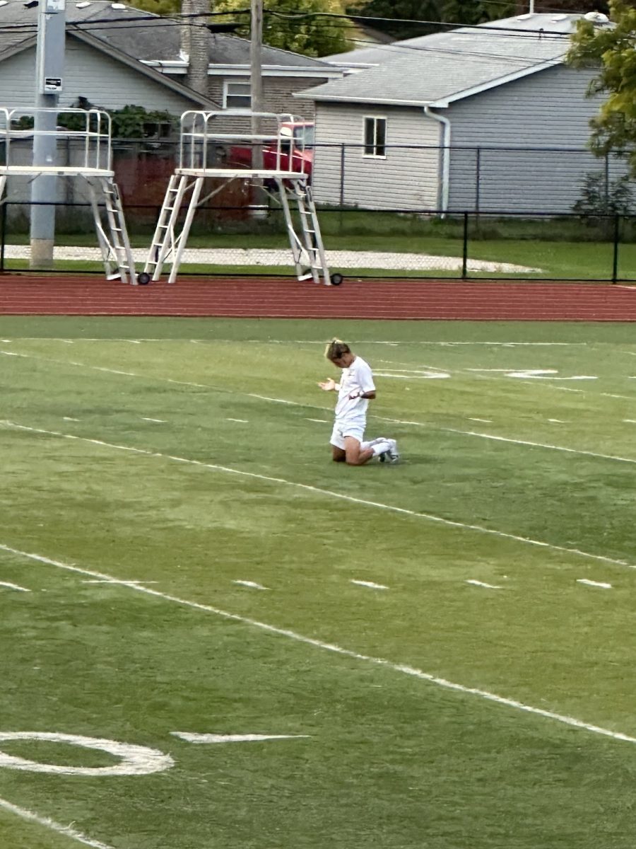 Ray Manjarrez praying during overtime at the Ridgewood game. The Tigers and Rebels were tied 2-2 in an intense match on Friday September 22nd.