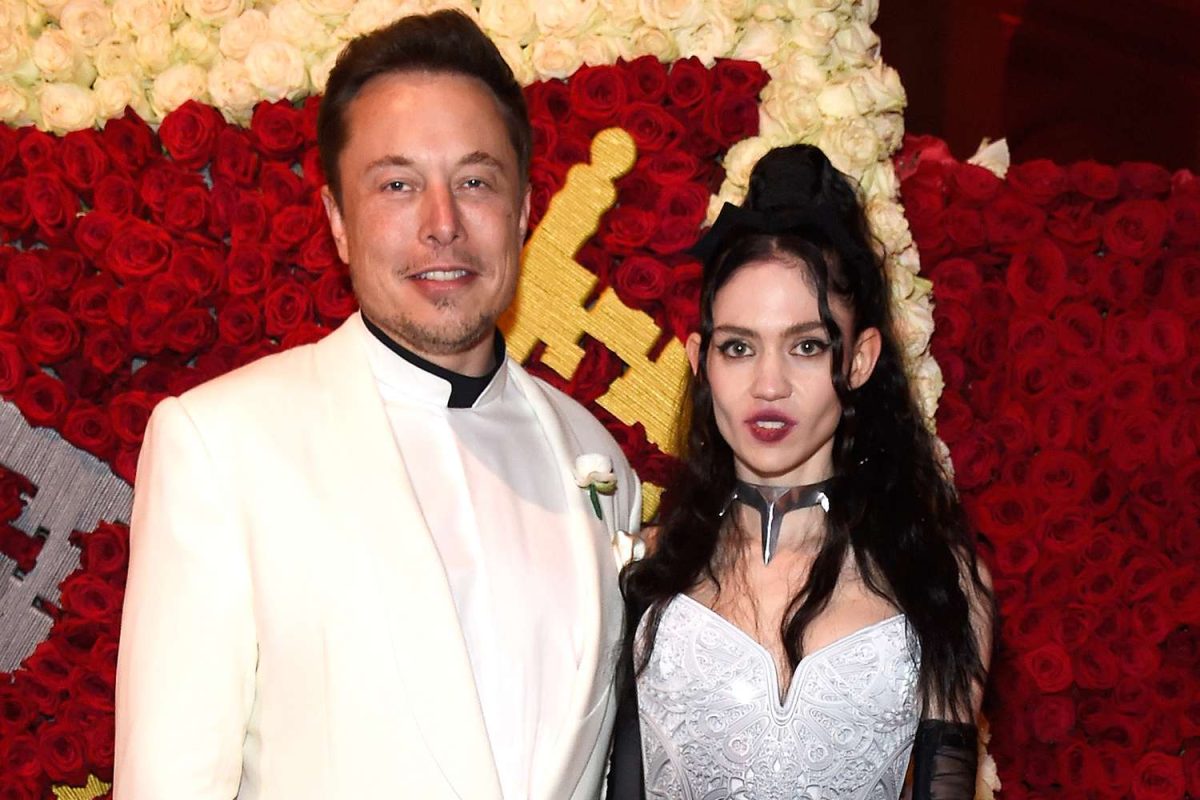 Elon musk and grimes together at a party 