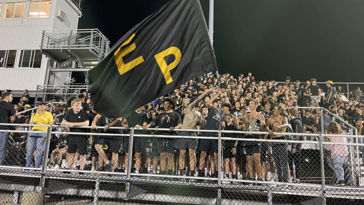 This picture represents the Elmwood Park student section for a football game themed black and gold. This image shows just how exciting football games can be with everyone dressing up and cheering.

