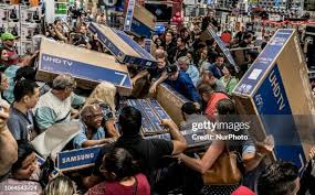 Starting with the explanation of Black Friday, this is a good photo showing how busy shopping can get. We can see people racing to get their hands on a TV. (Image found off Google)